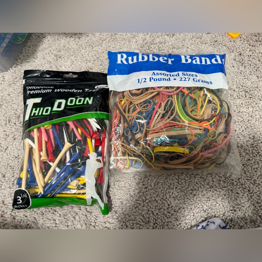 Premium wooden tees and assorted sizes of rubber bands